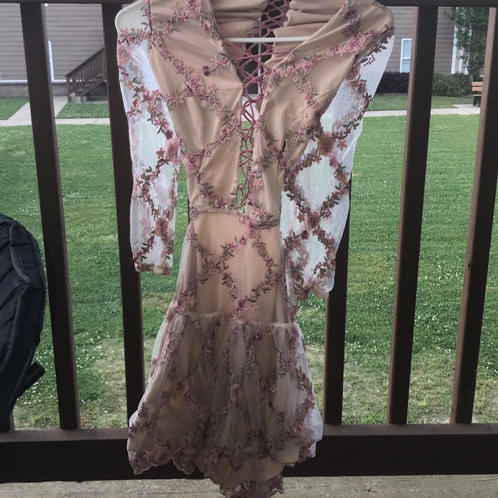 Pink lace and strap up dress.